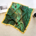 Detail of silk square scarf with malachite pattern and gold accents on plush rug - Dark Green Marble Style (FJ554-1)