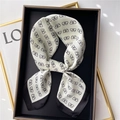 Elegant 70cm square silk scarf with butterfly print and black border on a tray - Off-white