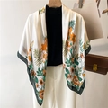Close-up of elegant floral print scarf with orange blossoms and deep green border detail - Cream Orange Flower Green Leaf (FE108-1)