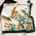 Detailed close-up of a 110cm silk scarf with floral patterns and a wide green border - White Green Flower Bird (FE108-1) / 110X110CM