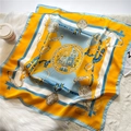 Close-up of a 70cm square silk scarf with luxury horse stirrup and medal print - Bright Yellow Equestrian Theme (FJ496-3)