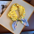 Silk-like square scarf featuring yellow FF monogram pattern and blue floral accents - Double F Monogram Style (FJ525-1)