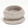 Close-up of soft khaki faux mink fur neck warmer with thick plush knitted texture - Apricot