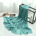 Detail of lightweight pleated turquoise shawl with silky texture on marble background - Lake Green (TH35-2) / 180x70cm