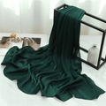 Detailed view of dark green pleated scarf texture draped over marble surface - Dark Green (TH35-3) / 180x70cm