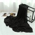 Close-up of black pleated chiffon shawl texture draped on a marble surface - Black (TH35-8) / 180x70cm