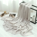 Detail of champagne crinkle pleated shawl draped on a minimalist display stand - Silver Gray (TH35-9) / 180x70cm