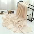 Detail view of light apricot pleated scarf draped on a geometric metal rack for display - Beige (TH35-19) / 180x70cm