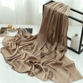 Detailed view of camel pleated shawl scarf draped elegantly on a modern minimalist metal rack - Dark Camel (TH35-24) / 180x70cm