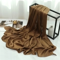 Close-up of caramel crinkle texture scarf draped elegantly over a black metal frame - Dark Brown (TH35-26) / 180x70cm