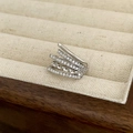 Detail of multi-layer silver ring with cubic zirconia stones in a beige velvet jewelry box - Silver Multi-layer Micro-set Ear Cuff (A-116)