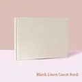 Minimalist beige linen guest book with a hard cover and elegant fabric texture finish - Blank Linen Guest Book