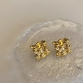 Macro view of gold plated square woven stud earrings with intricate metallic texture - Gold (Real Gold Plated)