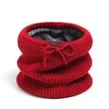 Close-up of red waffle knit neck warmer with soft grey fleece lining and drawstring detail - Red