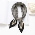 Detail of pleated silk scarf featuring black and white houndstooth pattern on a white desk - One Size / Light Khaki (FY83-2)