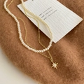 Detail of double-layer pearl necklace featuring a gold star pendant with micro-inlaid stones - Double Layer Pearl Eight-Pointed Star Pendant Style