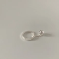 Detailed close-up of a silver minimalist chain ring with a polished bead pendant detail - Silver