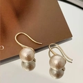 Close-up of cotton pearl earrings with gold hooks and unique textured matte finish - Cotton Pearl Earrings Real Gold Plated