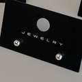 Macro shot of polished silver ball stud earrings displayed on a black jewelry card - Silver 4mm (Real Silver Plated)