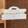 Verstelbare gouden sterrenarmband met zirkonia-bedels en een schuifsluiting - Gouden Ster Armband