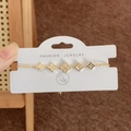 Adjustable gold four-leaf clover bracelet with white inlay and micro-pave crystals - Gold