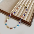 Detailed macro of handmade freshwater pearl necklace with colorful millefiori floral beads - Multicolor Freshwater Pearl Necklace (B-234)
