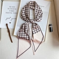 Detailed close-up of beige houndstooth skinny scarf with fine stitching and chic trim - Apricot Houndstooth (LE-37)