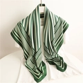 Elegant forest green and cream striped geometric silk scarf displayed on a white tee - 90x90cm / Green