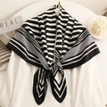 Modern geometric black and white striped silk square scarf shawl displayed on white garment - 90x90cm / Black Border