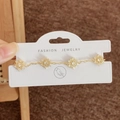 Elegant gold snowflake bracelet with zircon micro-paving on a white display card - Gold