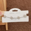 Silver snowflake bracelet with micro-pave cubic zirconia on a jewelry card - Silver