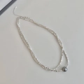 Detail of silver beaded double necklace featuring a central grey pearl and adjustable clasp - Double Layer Single Grey Pearl Necklace