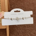 Elegant silver snowflake bracelet with micro-paved zircons and adjustable pull chain - Silver Bracelet