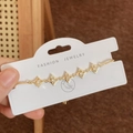 Eleganter Goldarmband mit hohlen Sternen, Zirkonia und verstellbarem Kordelzugverschluss - Gold