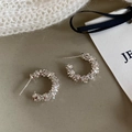Detailed view of silver C-hoop earrings featuring crushed silver textured surface design - Large / Silver