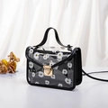 Transparent PVC crossbody bag with white daisy print and black leather trim accents - Black