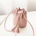 Pink drawstring bucket bag with circular embossing and elegant fringe tassels on the side - Pink