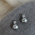 Grey round pearl stud earrings with micro-set zircon on textured grey knit fabric - Grey Pearl Zirconia Style (A-431)