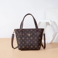 Retro dark brown bucket bag with clover monogram print and gold charm detail - Coffee