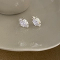 Detail of silver earring with molten metal texture and sparkling round zircon center - Silver White Zirconia Earrings