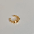 Macro view of the golden twisted croissant style ring with high polish metallic texture - Twisted Croissant Style / Gold