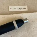 Macro shot of silver woven rope ring with pave-set cubic zirconia on textured fabric - Woven Texture Zirconia Style (Silver/C-157)