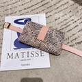 Pink and black zebra print waist bag with gold ring buckle on a white book - Pink Zebra Print