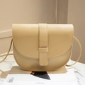 Elegant beige saddle shoulder bag with minimalist leather flap and fine stitching detail - Off-white