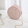 Elegant light pink round crossbody bag with floral embroidery and gold chain strap - Pink