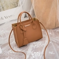 Brown lychee pattern Kelly style handbag with adjustable shoulder strap and gold logo - Brown