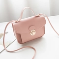 Pink crossbody square bag with golden buckle and textured synthetic leather finish - Pink