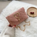Pink quilted crossbody bag with golden heart lock and metal fringe on chain strap - Pink