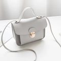 Light grey square crossbody bag with gold rotating lock and matte leather finish - Gray
