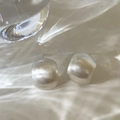 Macro shot of silver minimalist stud earrings featuring a brushed matte metallic texture - Western Brushed Silver Style (A-393)